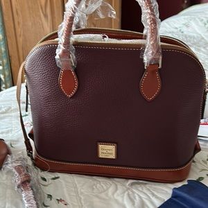 Beautiful new to you Dooney and Bourke deep burgundy satchel.  12” by 12 “.